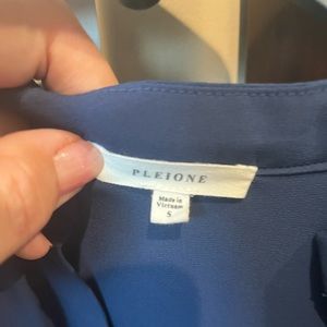 Blue short sleeve blouse pocket on front